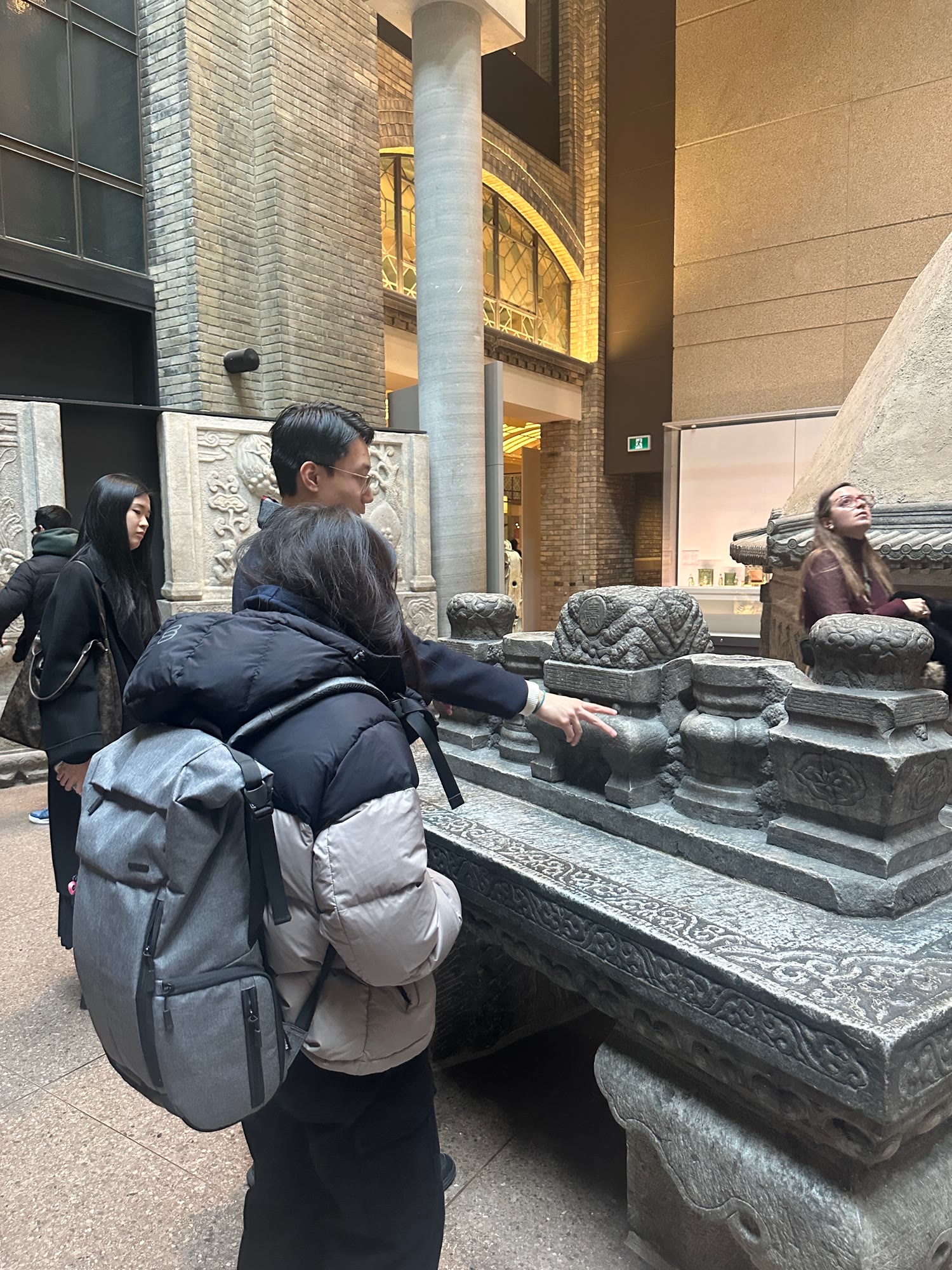 Club members examining architectural carvings